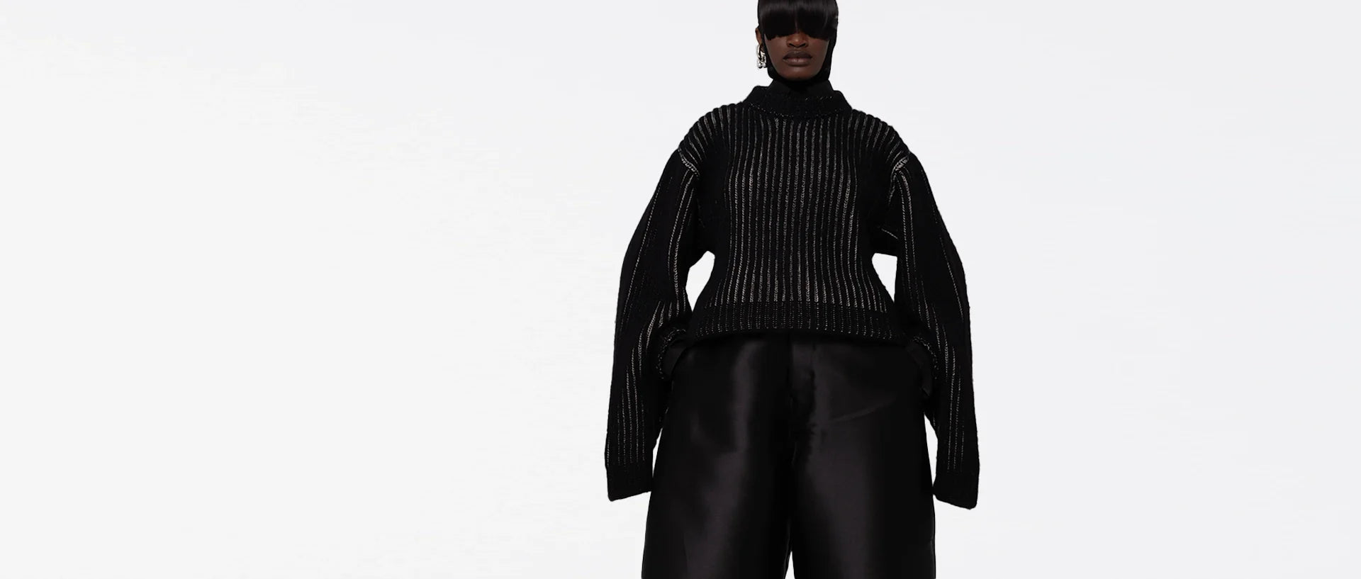 two african american models wearing knit cardigans, black and white