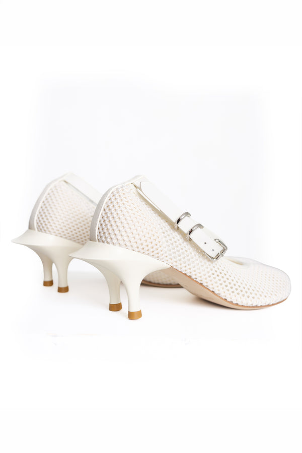 A pair of women's Mary Jane-style heels in off-white, featuring a textured mesh upper, a low kitten heel, and a double-buckle strap design.