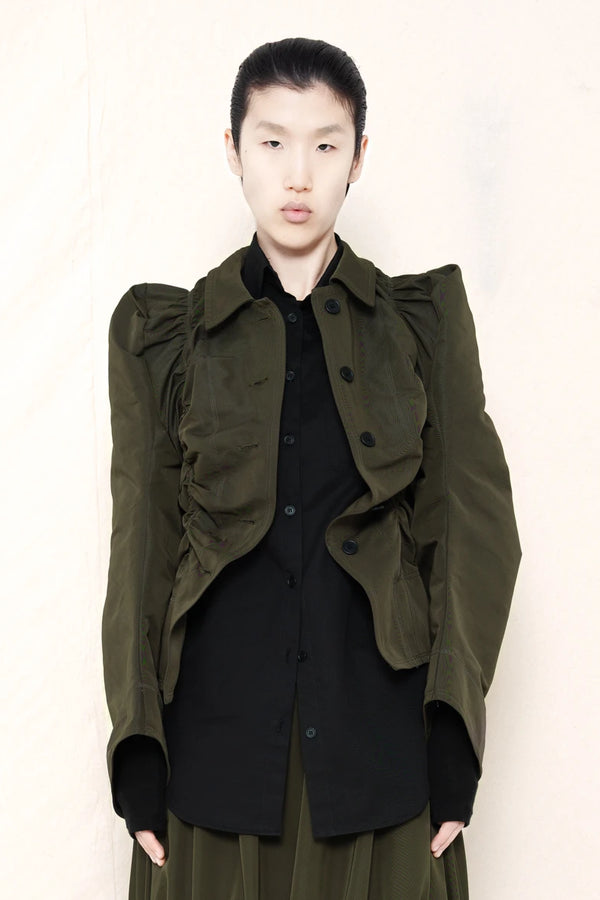 PERSON-WEARING-MOSS-RUCHED-JACKET-OVER-BLACK-BUTTON-DOWN-WITH-MOSS-RUCHED-SKIRT-AND-CUSTOMIZED-SNEAKERS-FRONT-VIEW