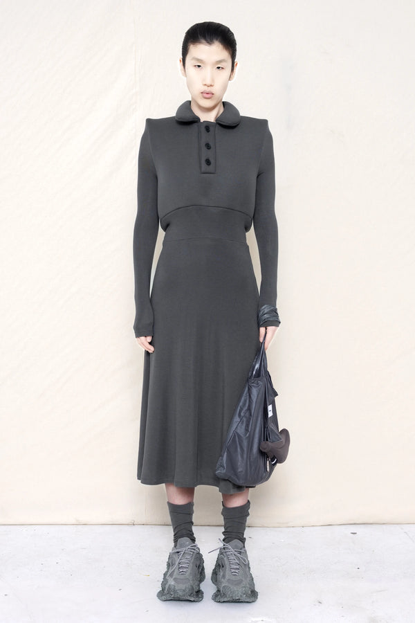 PERSON-WEARING-WARM-GREY-FOAMY-POLO-LONGSLEEVE-DRESS-WITH-MATCHING-SOCKS-AND-CUSTOMIZED-SNEAKERS-HOLDING-WARM-GREY-BANANA-TOTE-BAG-FRONT-VIEW