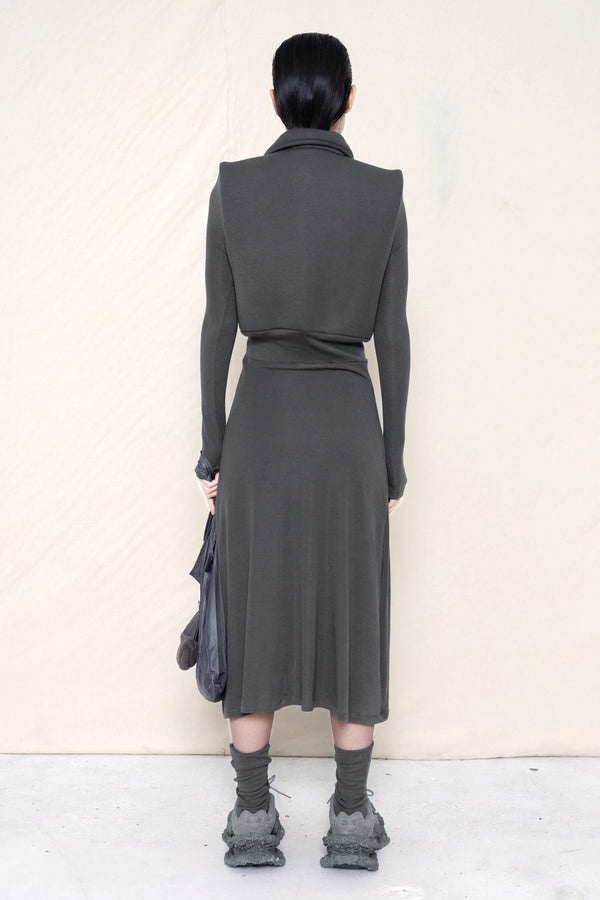 PERSON-WEARING-WARM-GREY-FOAMY-POLO-LONGSLEEVE-DRESS-WITH-MATCHING-SOCKS-AND-CUSTOMIZED-SNEAKERS-HOLDING-WARM-GREY-BANANA-TOTE-BAG-BACK-VIEW
