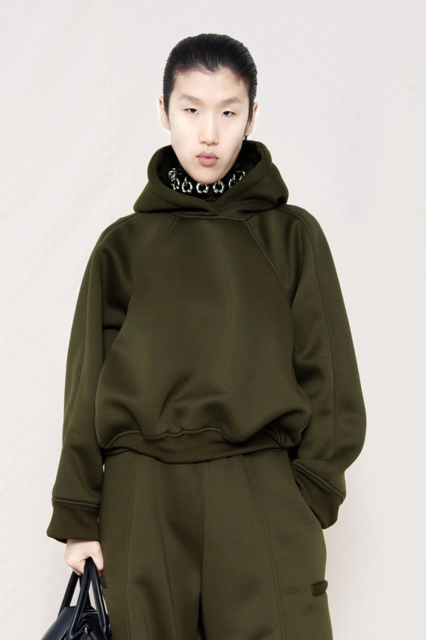 PERSON-WEARING-PIERCED-CHOKER-UNDER-MOSS-CROPPED-HOODIE-WITH-MATCHING-MOSS-ROUND-LEG-LOUNGEPANTS-HOLDING-BLACK-BAG-CLOSE-UP-FRONT-VIEW