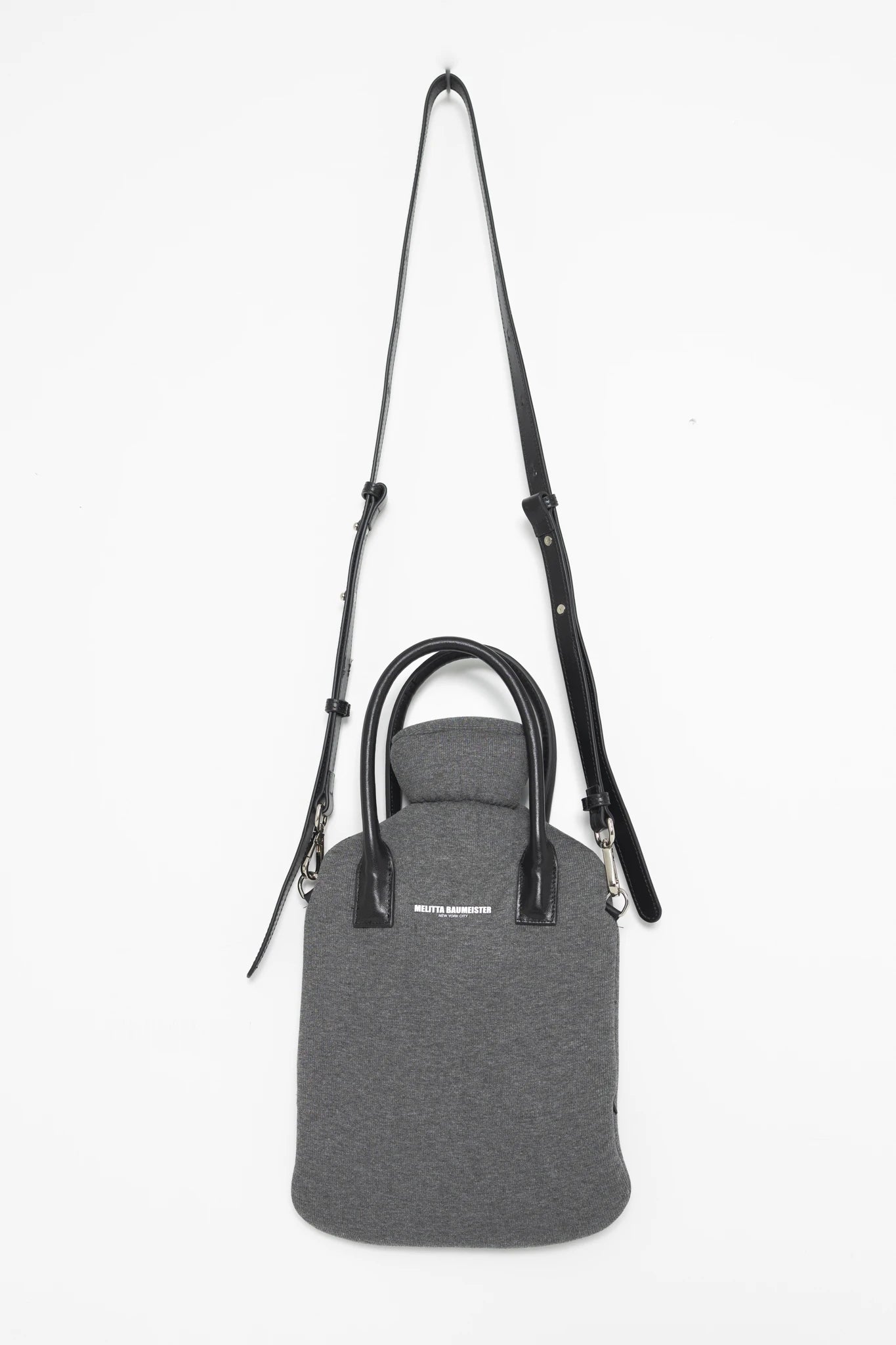MELANGE-HOT-WATER-BOTTLE-SHAPED-BAG-WITH-BLACK-LEATHER-STRAPS-AND-LONG-CROSS-BODY-STRAP-FRONT-VIEW