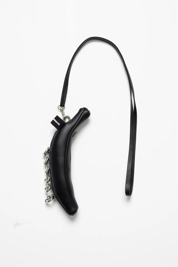 BLACK-BANANA-TOTE-WITH-PIERCED-DETAIL-AND-LONG-STRAP-ATTACHED
