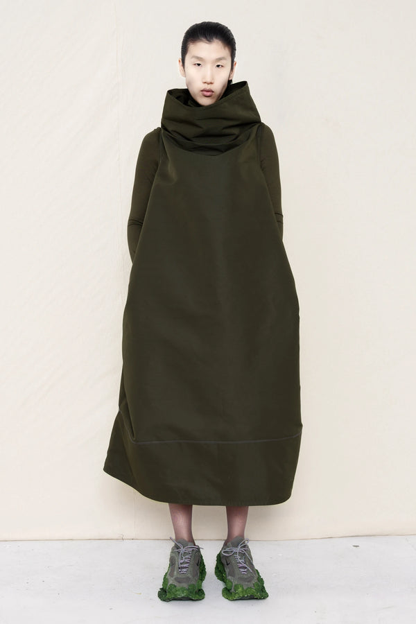 PERSON-WEARING-MOSS-HIGH-COLLAR-DRESS-OVER-MATCHING-COLORED-LONGSLEEVE-WITH-CUSTOMIZED-SNEAKERS-FRONT-VIEW