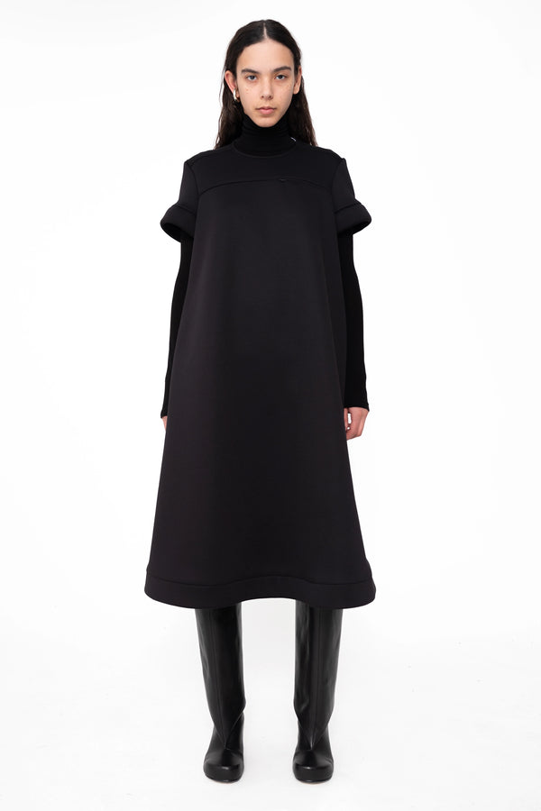 female-wearing-black-midi-aline-dress-with-short-sleeves-on-white-background-full-body-front