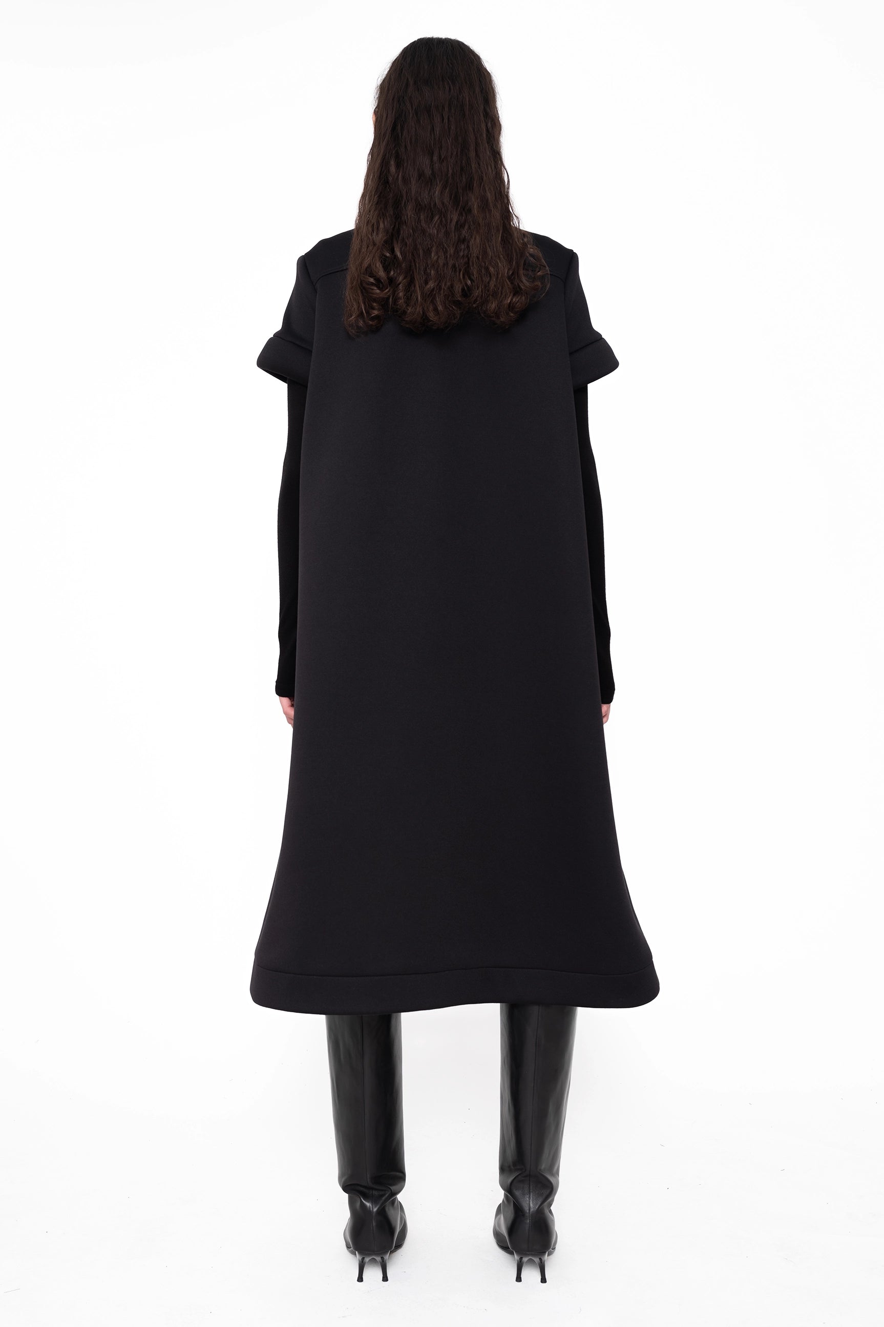 female-wearing-black-midi-aline-dress-with-short-sleeves-on-white-background-full-body-back