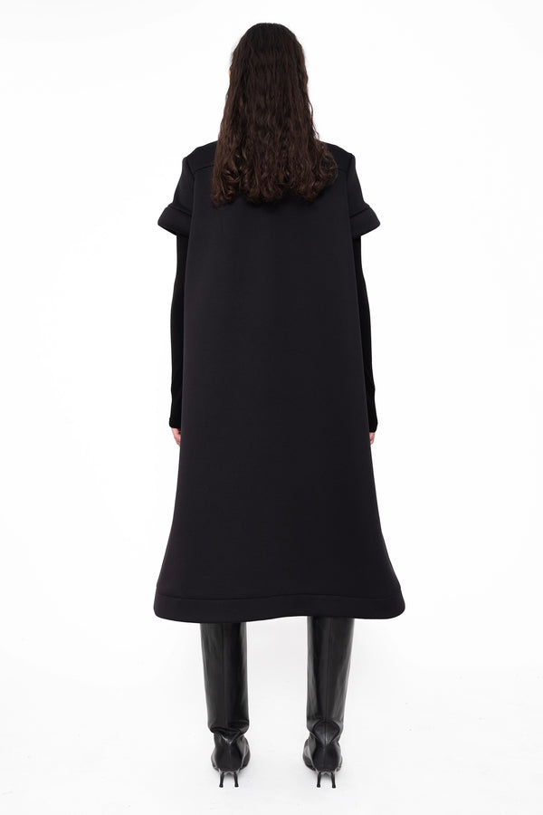 female-wearing-black-midi-aline-dress-with-short-sleeves-on-white-background-full-body-back