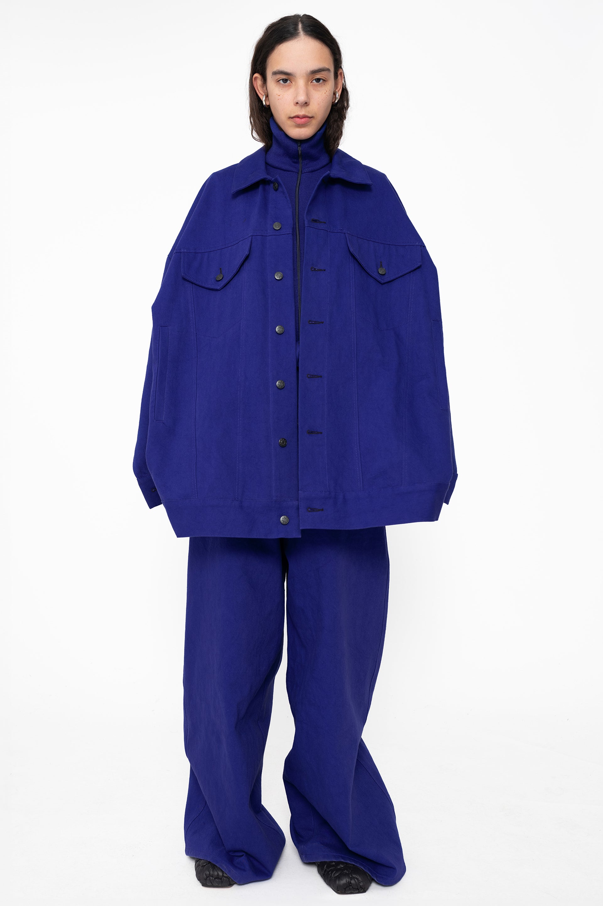 female-wearing-blue-oversized-belted-denim-jacket-with-blue-denim-pants-full-body-front