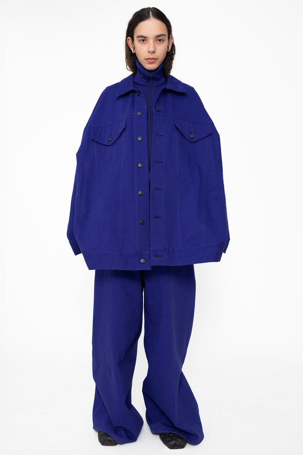 female-wearing-blue-oversized-belted-denim-jacket-with-blue-denim-pants-full-body-front