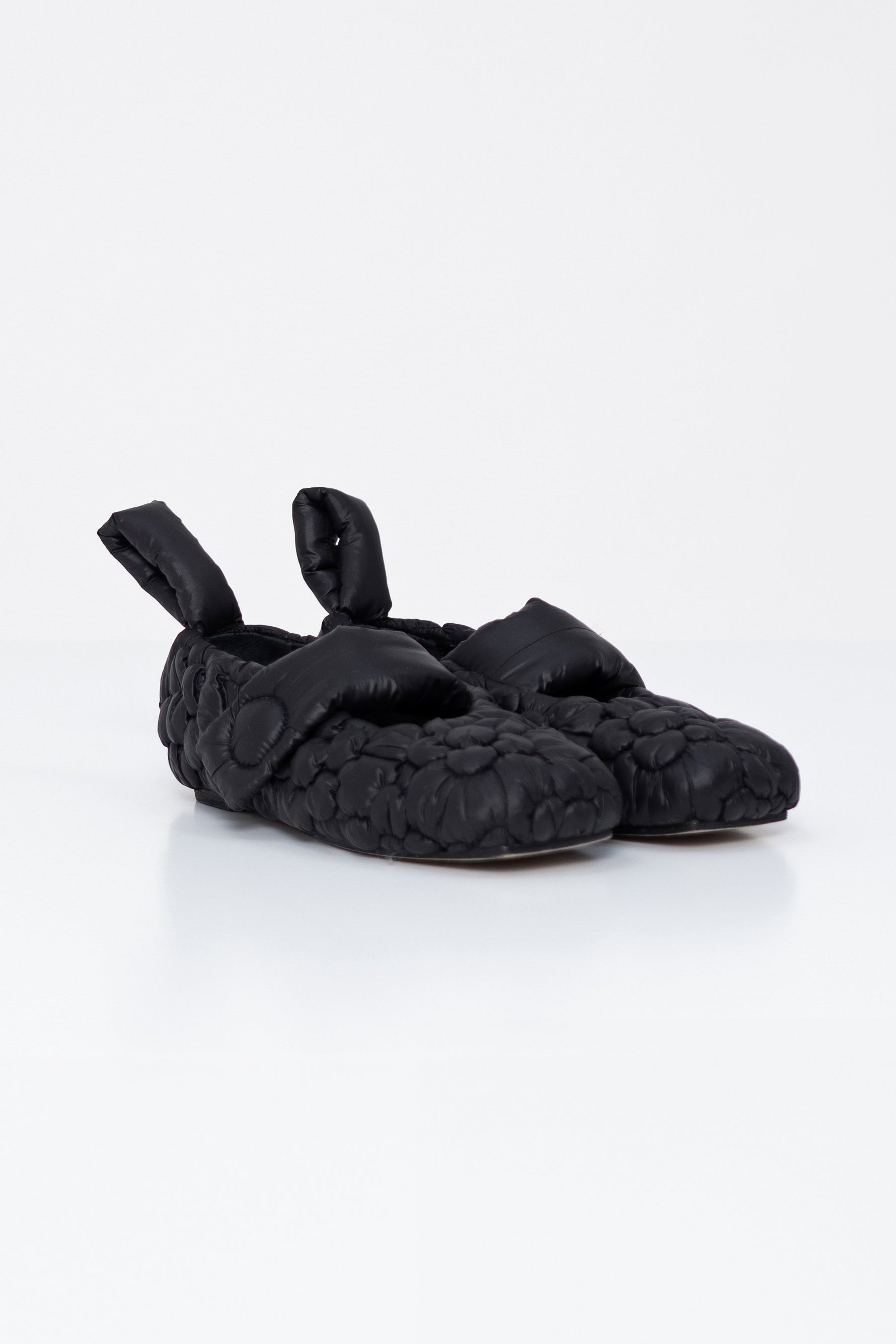 black-buffered-mary-janes-with-flower-embroidery-on-white-background