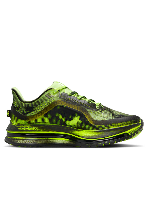 Black and green sneaker on a white background