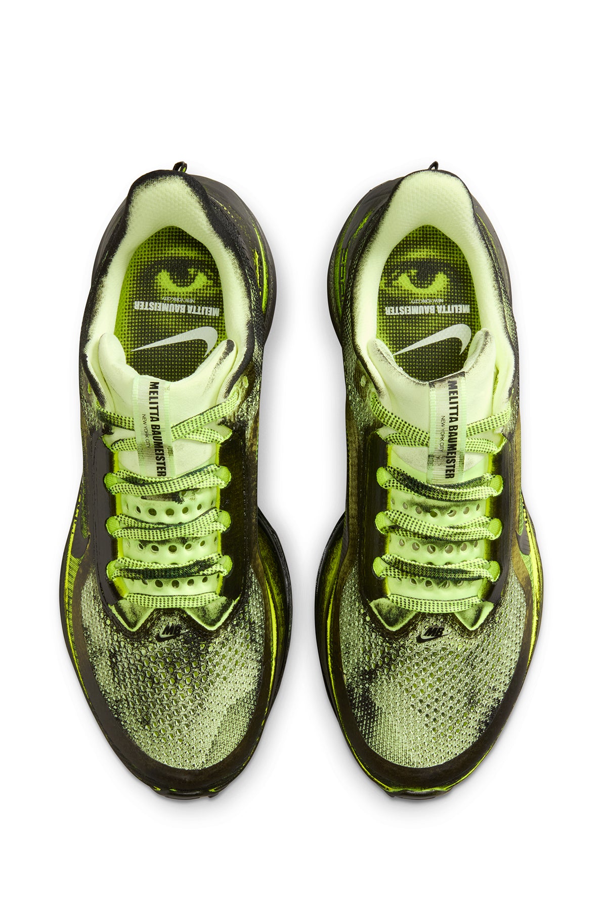 Pair of neon green and black sneakers on a white background