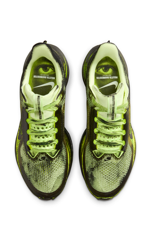 Pair of neon green and black sneakers on a white background