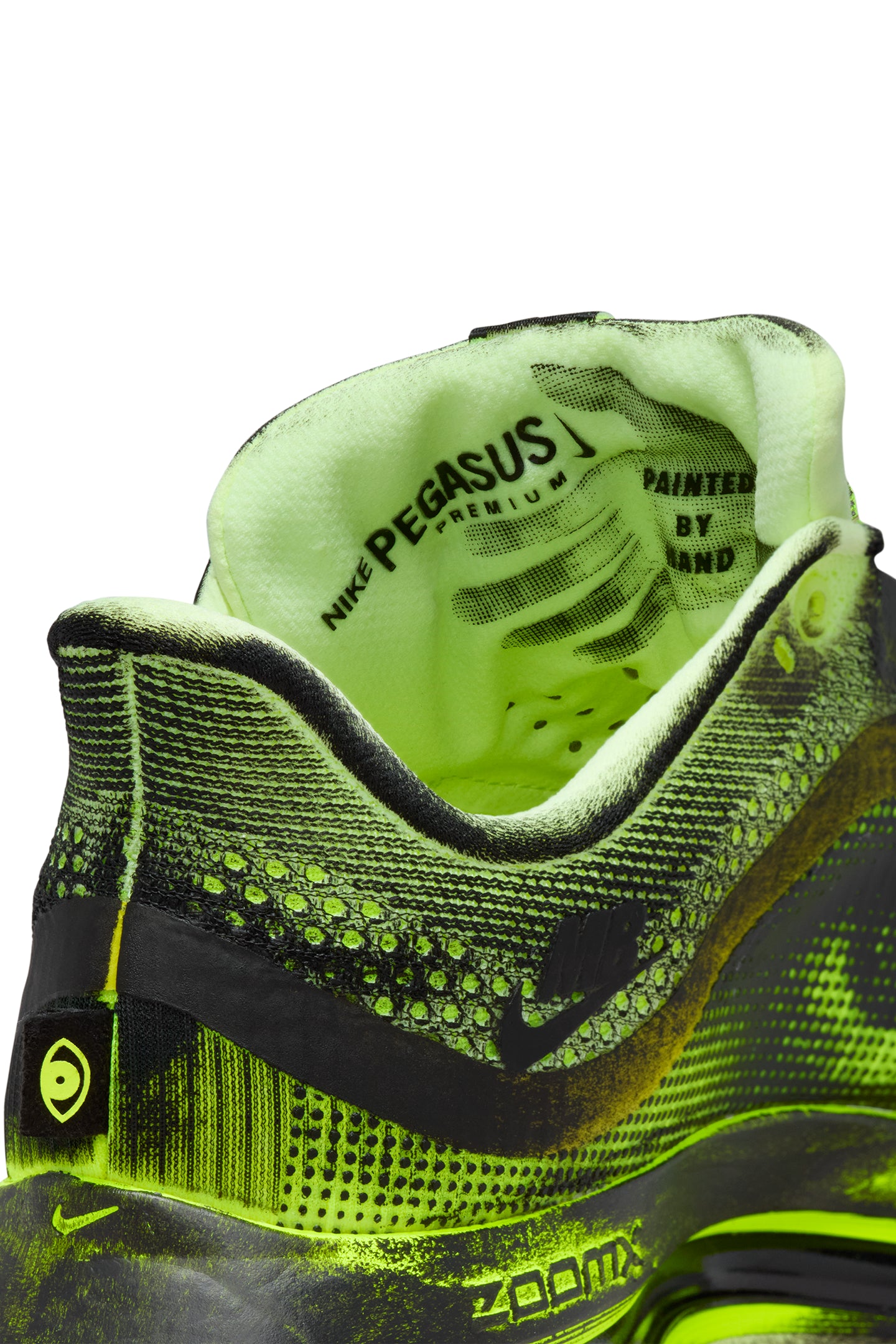 Close-up of a neon green running shoe with 'Nike Pegasus' branding.