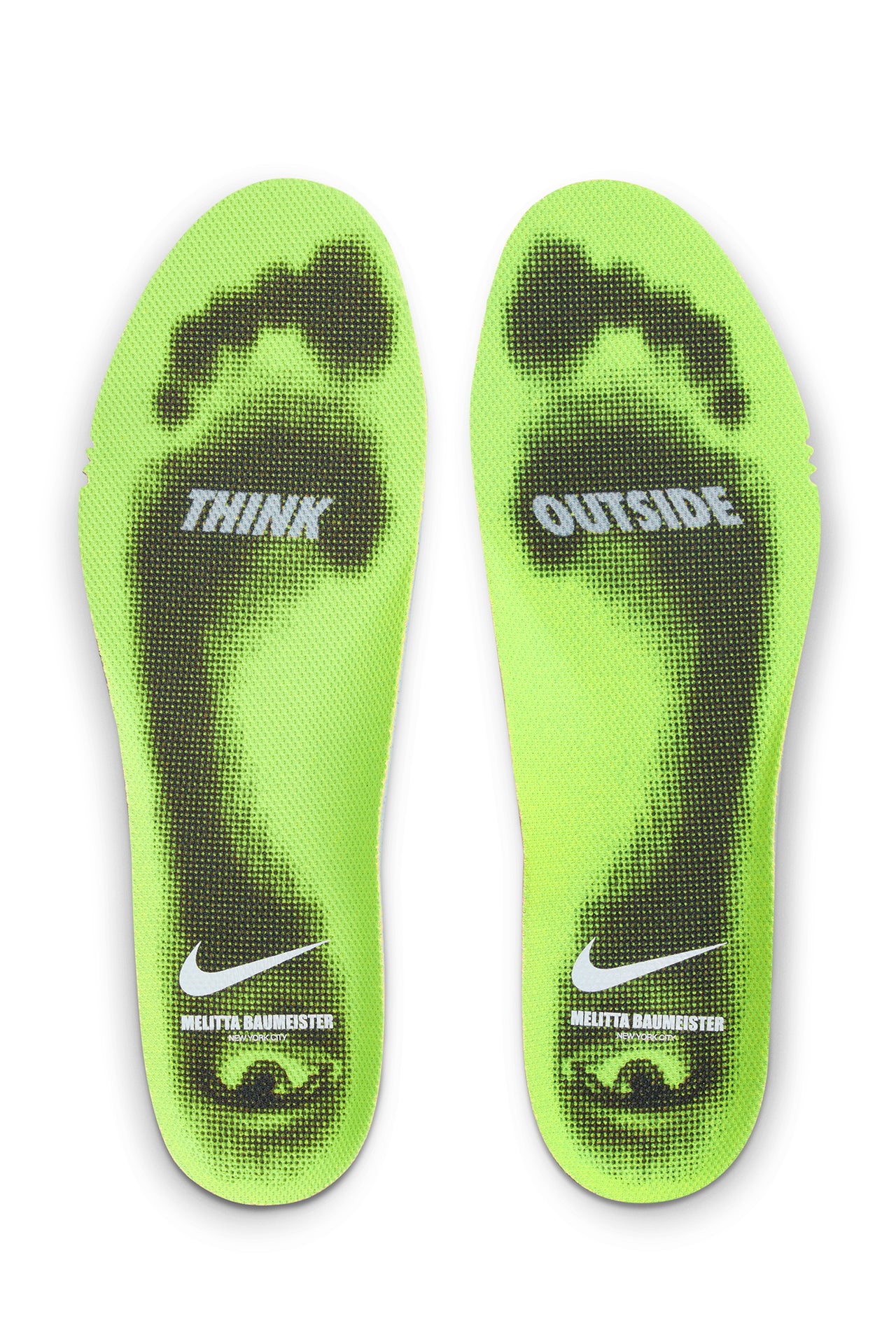 Green insoles with 'Think Outside' text and Nike logo on a white background