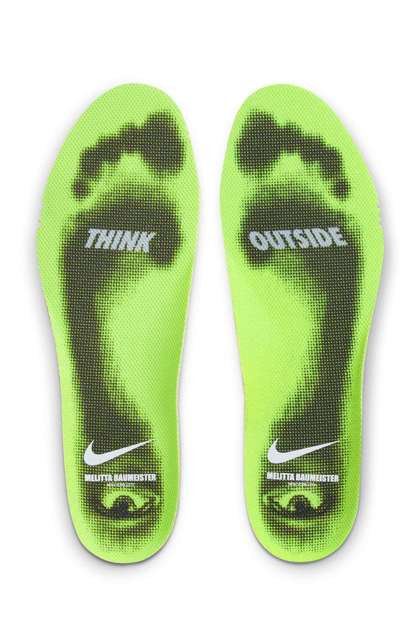 Green insoles with 'Think Outside' text and Nike logo on a white background