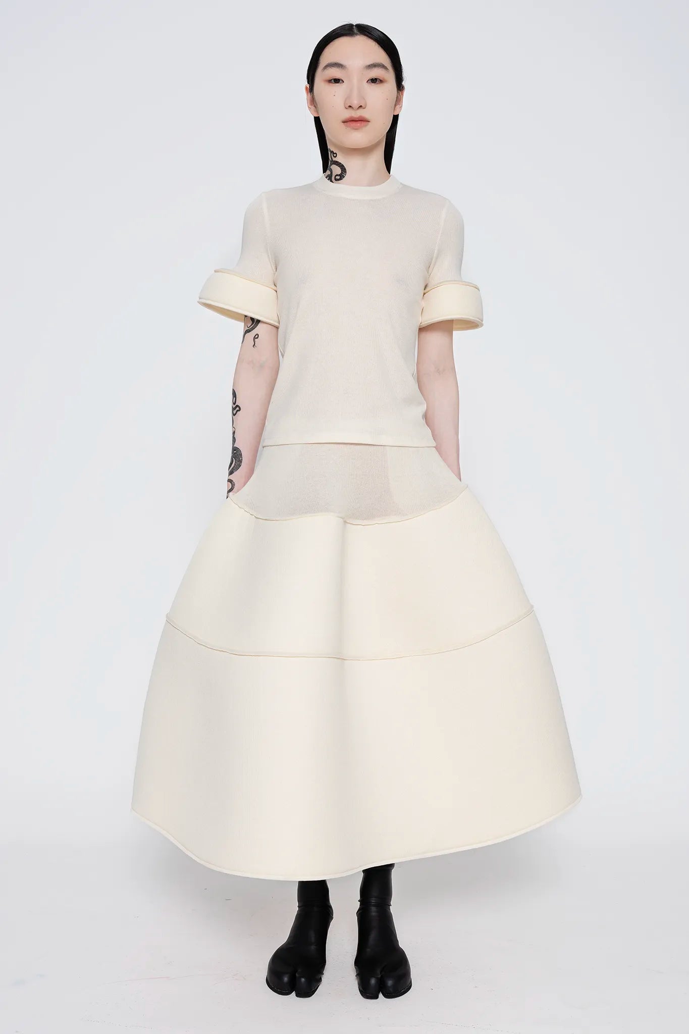 MELITTA-BAUMEISTER-Foam-Cuff-Tee-in-Ivory-FULL-BODY-VIEW-WORN-WITH-FOAM-LARGE-SKIRT-IN-IVORY-AND-BLACK-LEATHER-SHOES