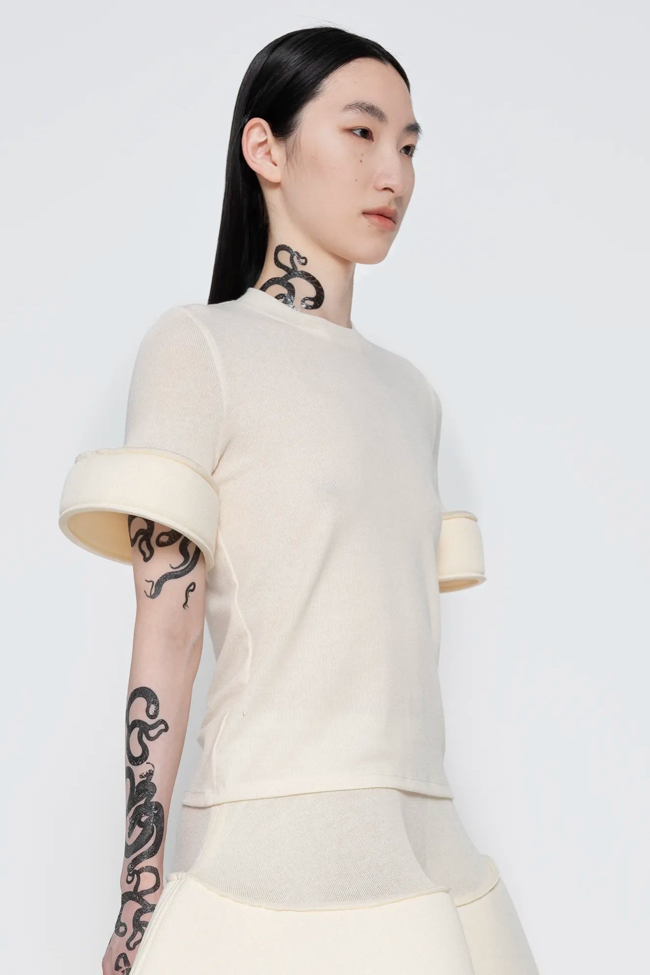 MELITTA-BAUMEISTER-Foam-Cuff-Tee-in-Ivory-SLIGHT-RIGHT-SIDE-VIEW