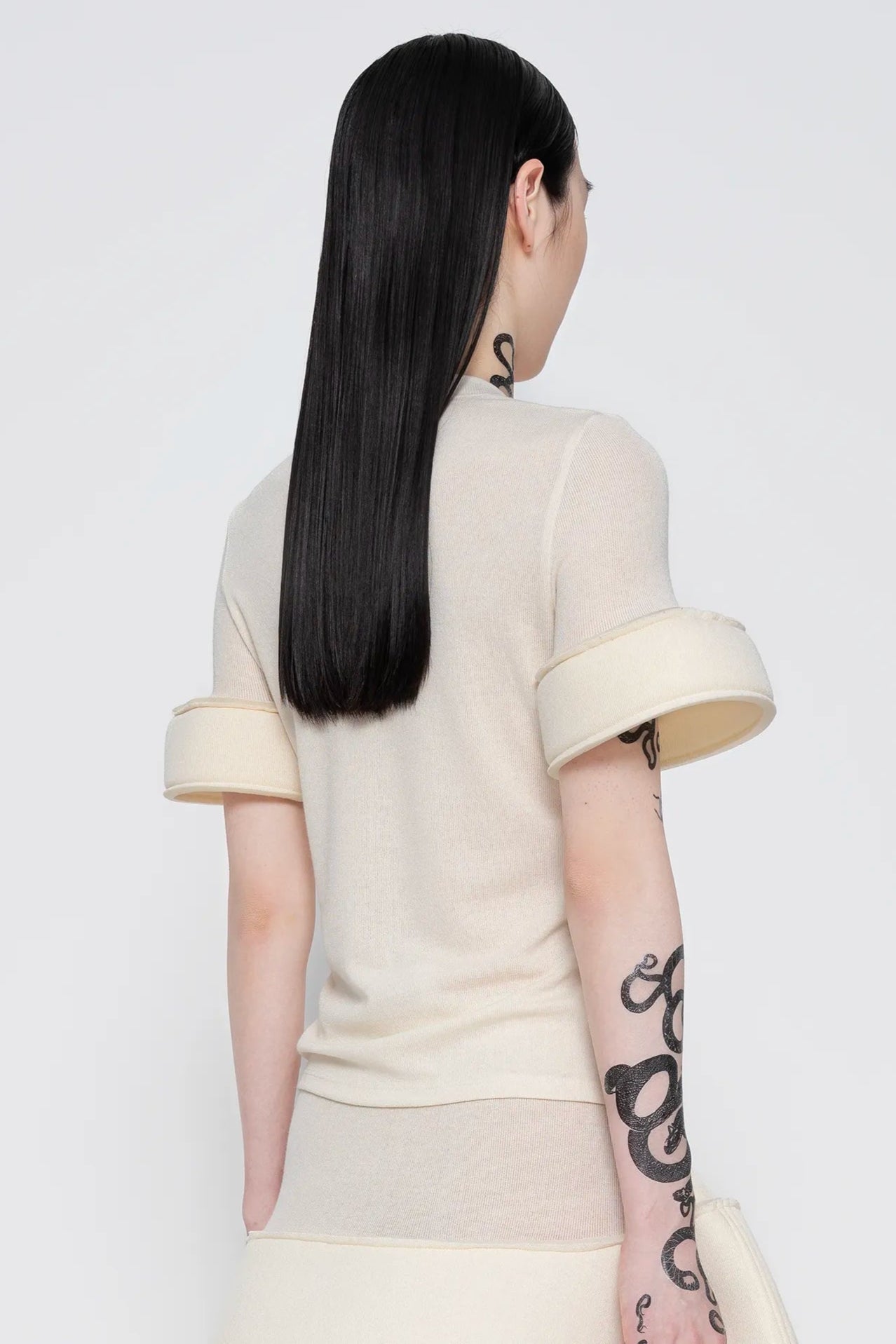 MELITTA-BAUMEISTER-Foam-Cuff-Tee-in-Ivory-SLIGHT-RIGHT-SIDE-BACK-VIEW