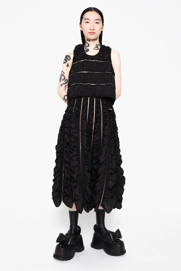 MELITTA-BAUMEISTER-Ruched-Tank-Black-FRONT-VIEW-FULL-BODY-WITH-SAME-MATERIAL-LONG-SKIRT-AND-BLACK-LEATHER-BOW-SHOES