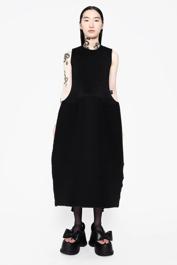 MELITTA-BAUMEISTER-Sleeveless-Ripple-Dress-Black-LONG-BLACK-HAIR-FEMALE-MODEL-SNAKE-TATTOOS-ALSO-WEARING-BLACK-LEATHER-BOW-SHOES