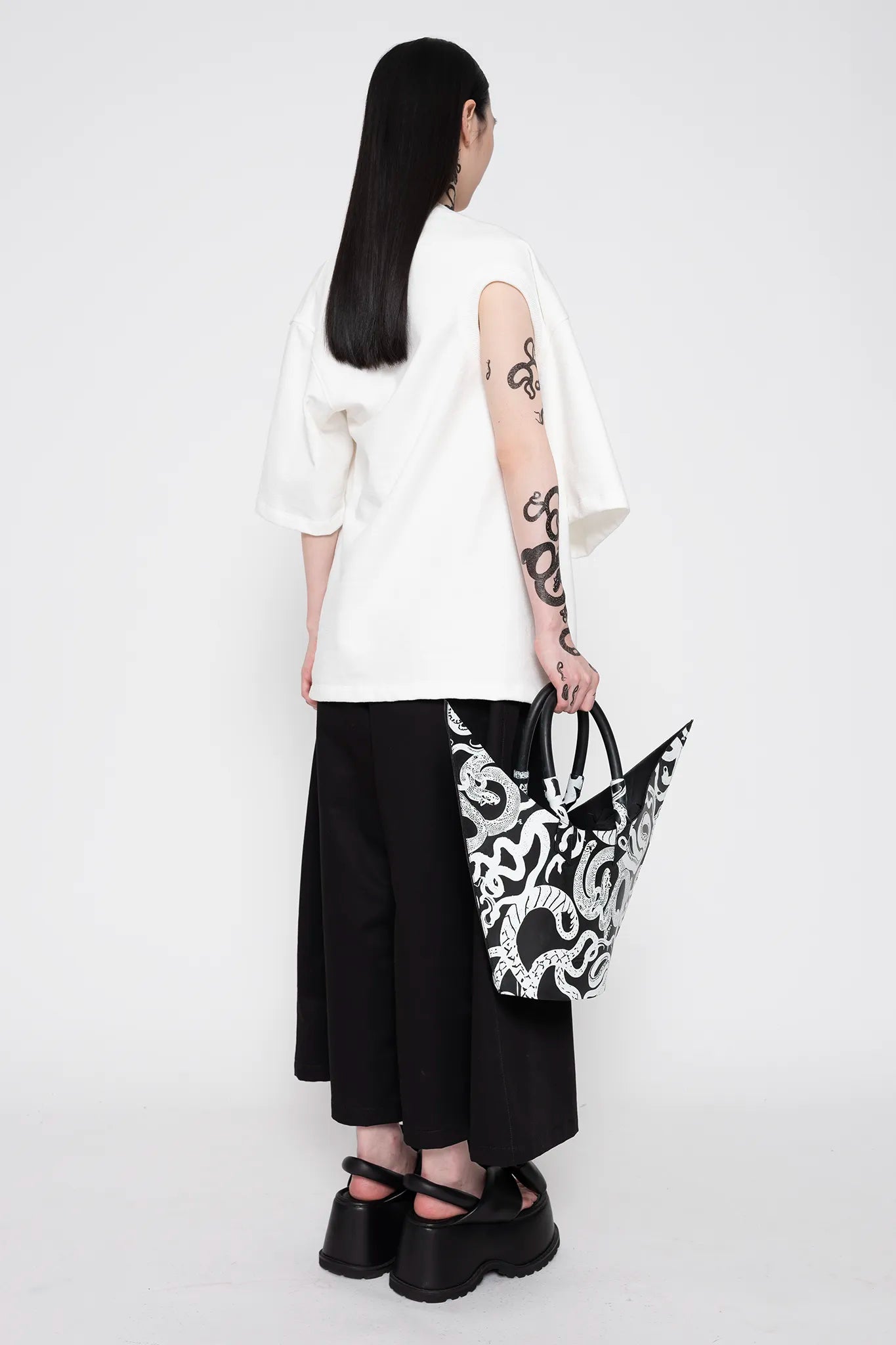 MELITTA-BAUMEISTER-Twisted-Tee-White-SLIGHT-RIGHT-SIDE-BACK-VIEW