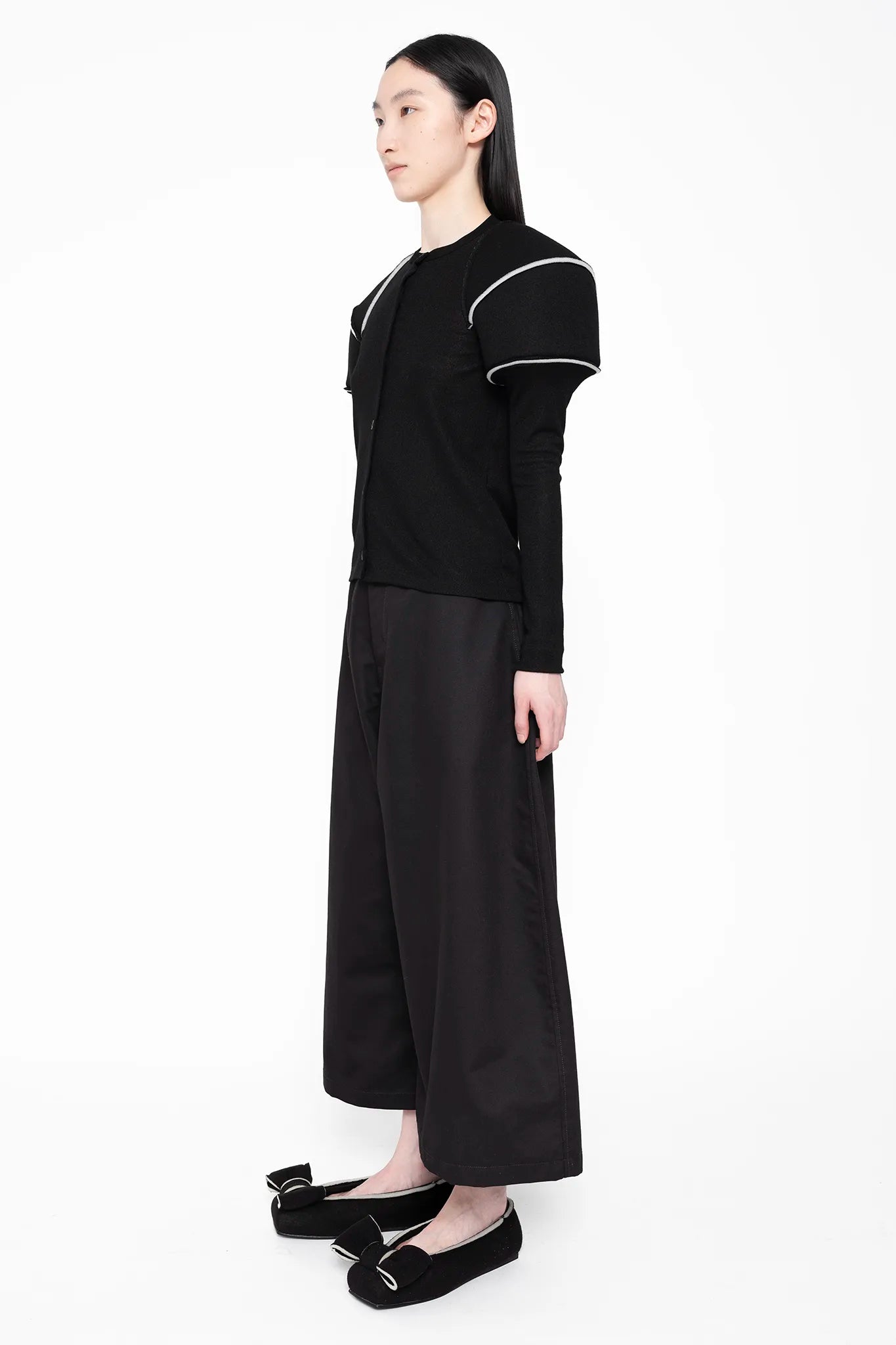 MELITTA-BAUMEISTER-Wide-Leg-Culotte-Black-SLIGHT-LEFT-SIDE-VIEW-STYLED-WITH-NLACK-FLATS-WITH-BOW-AND-WHITE-STRIPE-TOP-HAS-SAME-LOOK-AS-SHOES