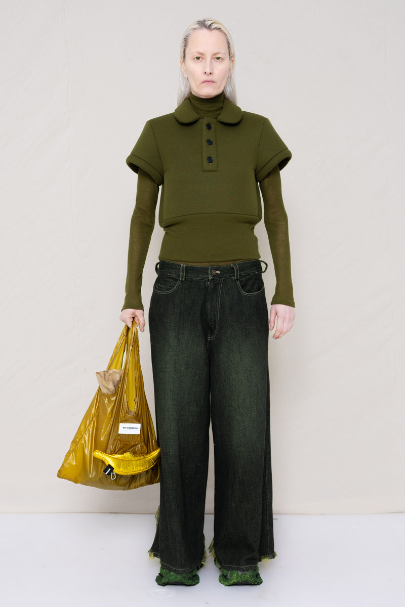 PERSON-WEARING-MOSS-FOAMY-POLO-WITH-MOSS-LONG-SLEEVE-TURTLENECK-UNDER-AND-BLACK-YELLOW-WASH-DENIM-PANTS-WITH-CUSTOMIZED-SNEAKERS-HOLDING-GOLD-BANANA-TOTE-BAG-FRONT-VIEW