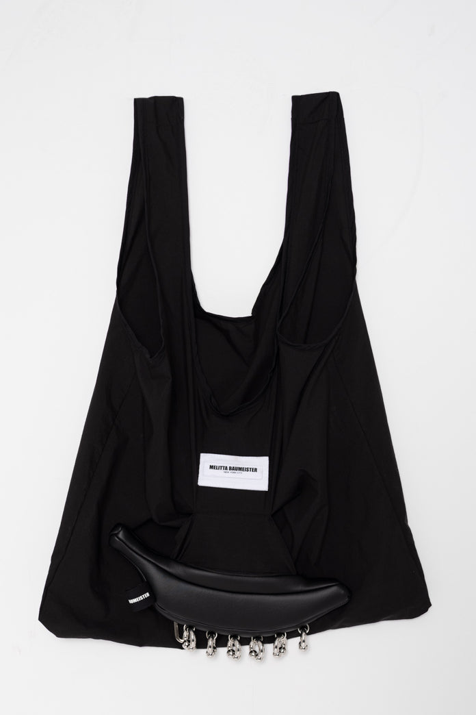pierced-black-banana-clutch-unfolded-into-a-nylon-tote-front-view