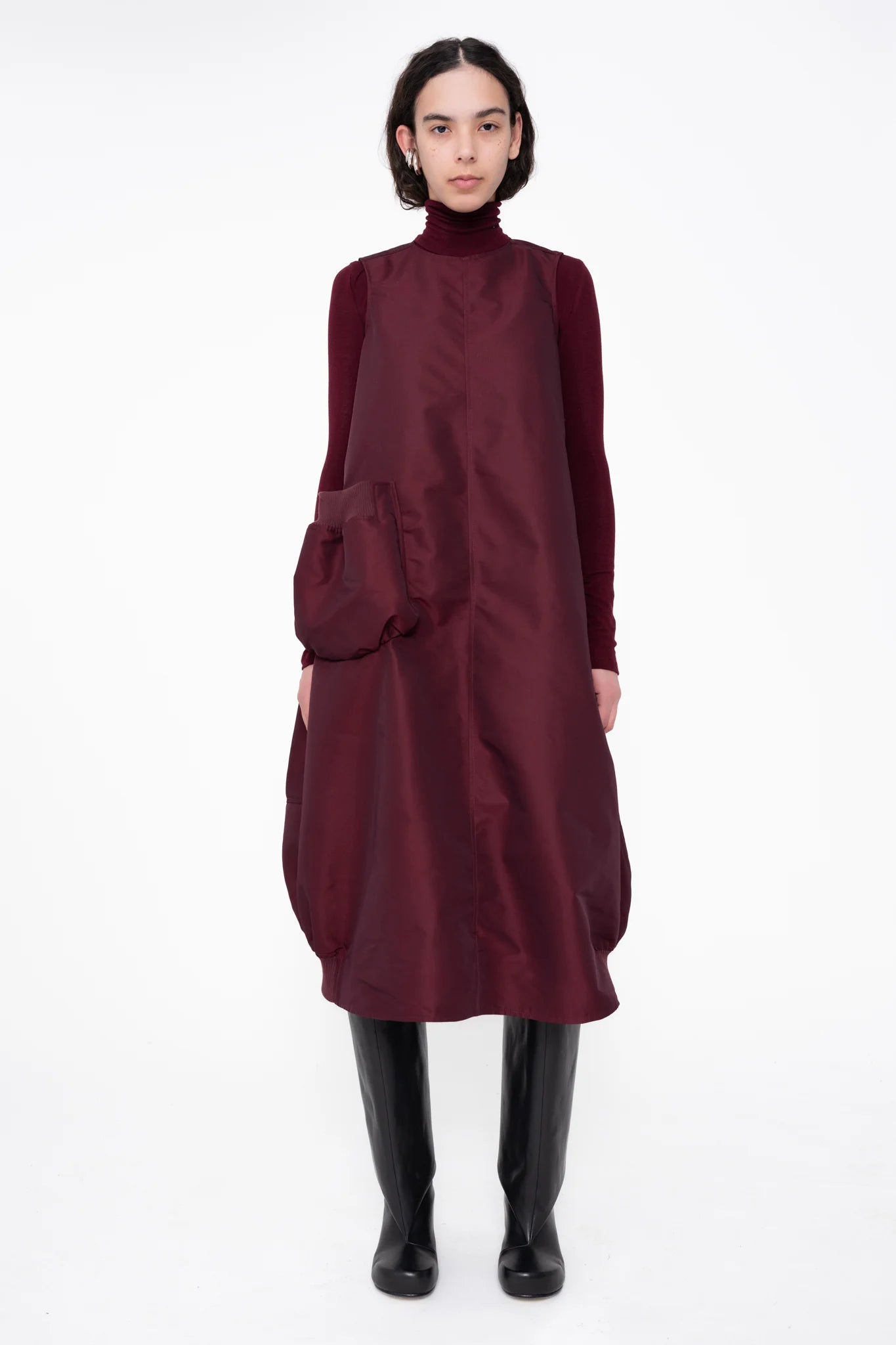 female-wearing-bordeaux-bomber-dress-with-big-front-pocket-on-white-background-full-body-front