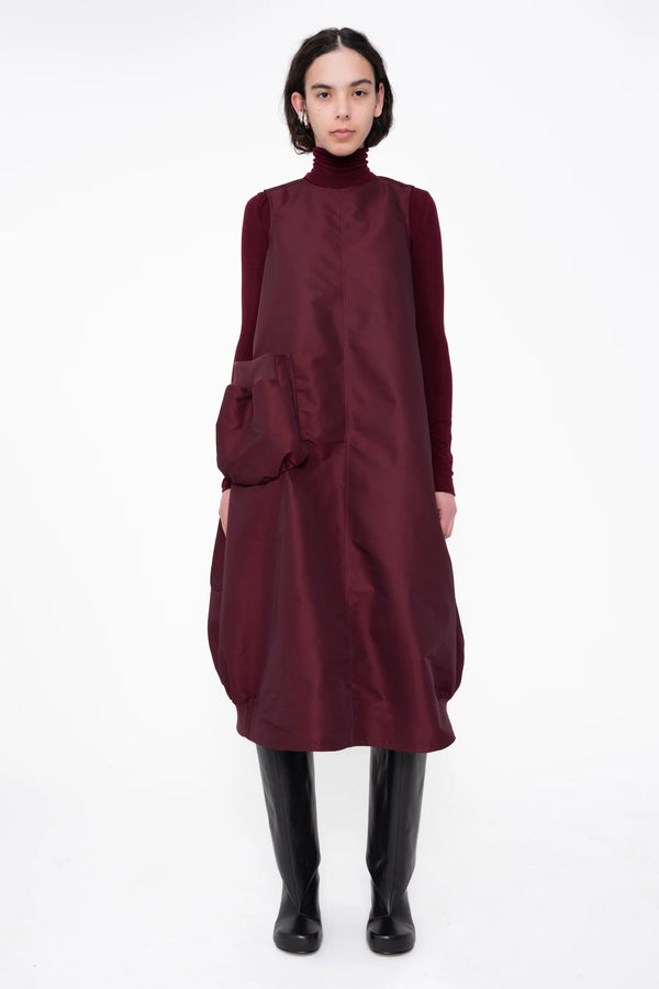 female-wearing-bordeaux-bomber-dress-with-big-front-pocket-on-white-background-full-body-front