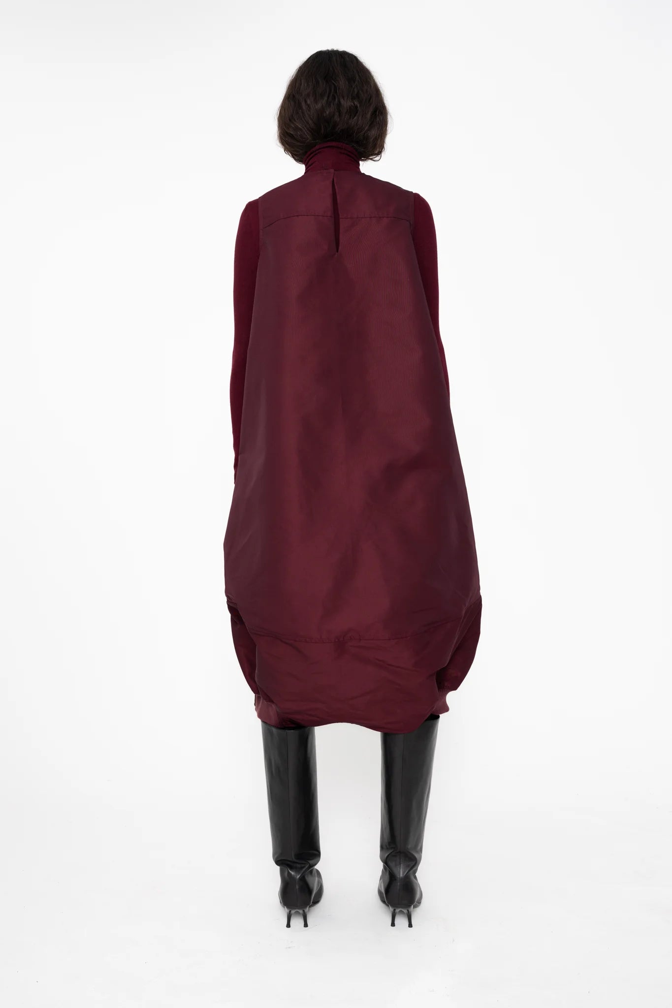 female-wearing-bordeaux-bomber-dress-with-big-front-pocket-on-white-background-full-body-back