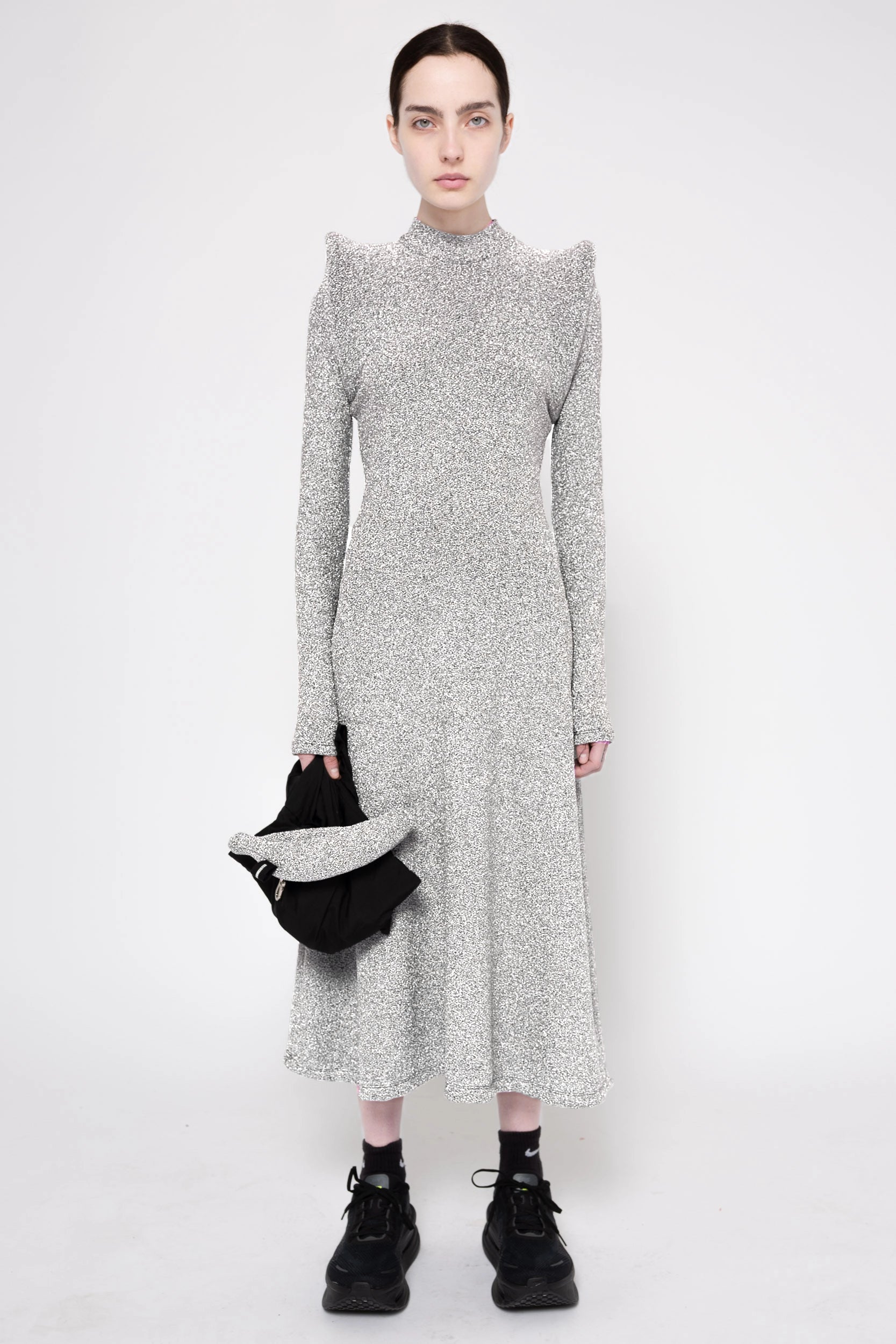 Model wearing silver column dress on a white background, front.