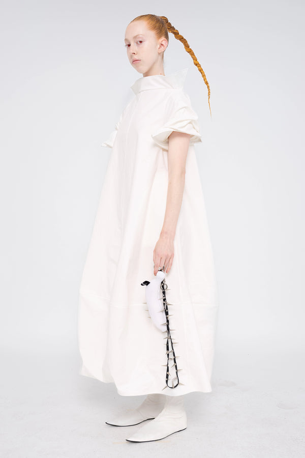 female-wearing-white-maxi-dress-with-stand-up-collar-and-short-pointy-sleeves-on-white-background-full-body-three-quarter