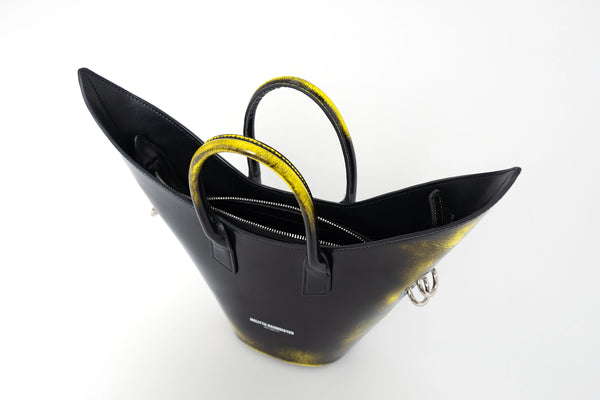 BLACK-PAINTED-POINTY-SHOULDER-BAG-WITH-SPIKED-CROSSBODY-STRAP-FROM-ABOVE-VIEW