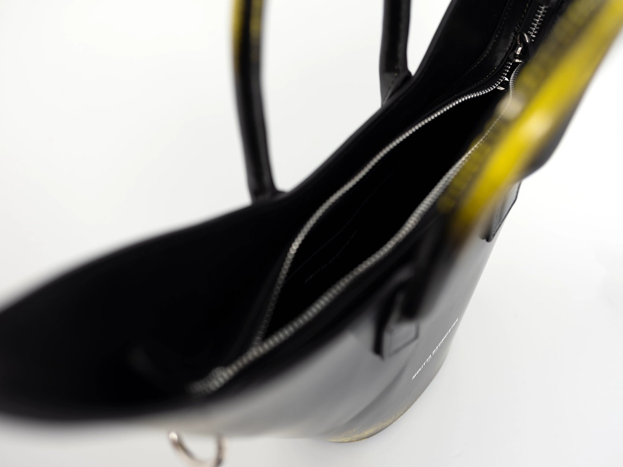 BLACK-PAINTED-POINTY-SHOULDER-BAG-WITH-SPIKED-CROSSBODY-STRAP-CLOSE-UP-VIEW