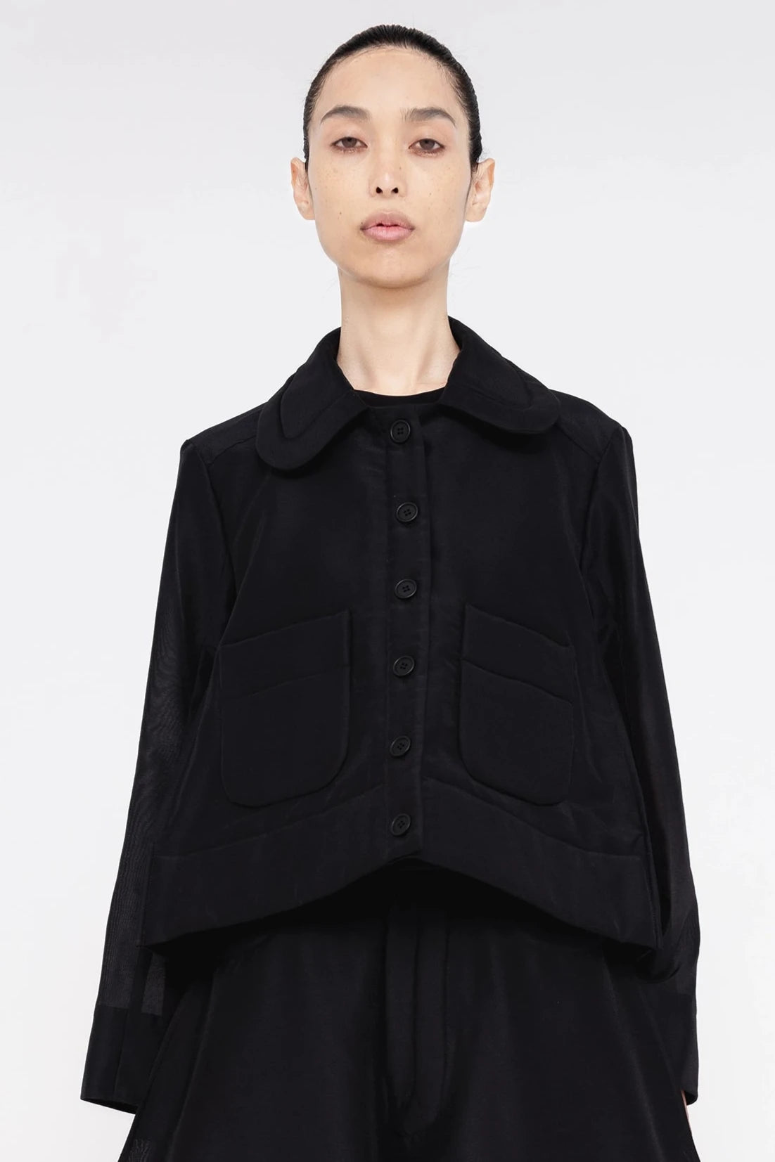 PERSON-WEARING-BLACK-A-LINE-SHIRT-JACKET-AND-MATCHING-PANTS-CLOSE-UP-FRONT-VIEW