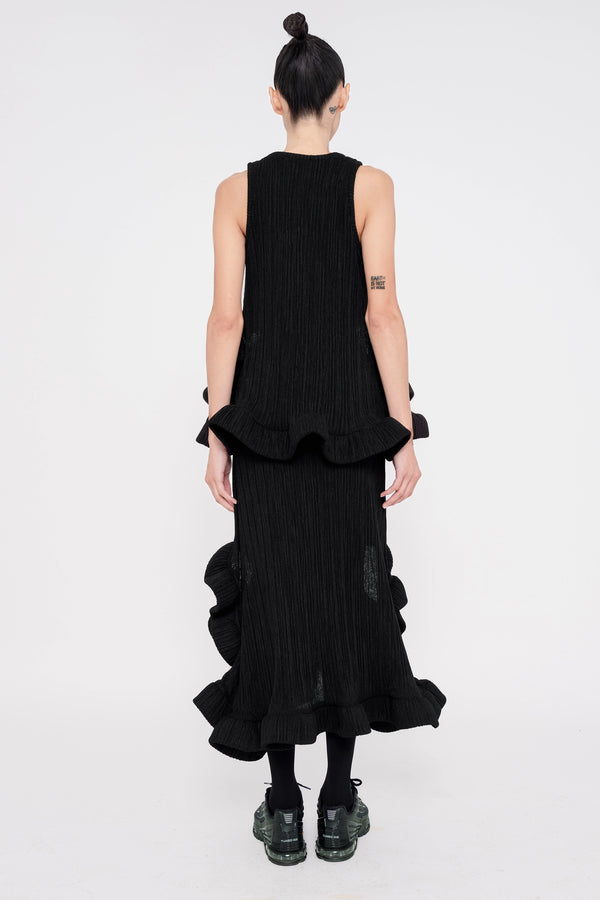 female-wearing-black-ruffled-tank-top-and-black-ruffled-skirt-with-holes-on-white-background-full-body-back-view