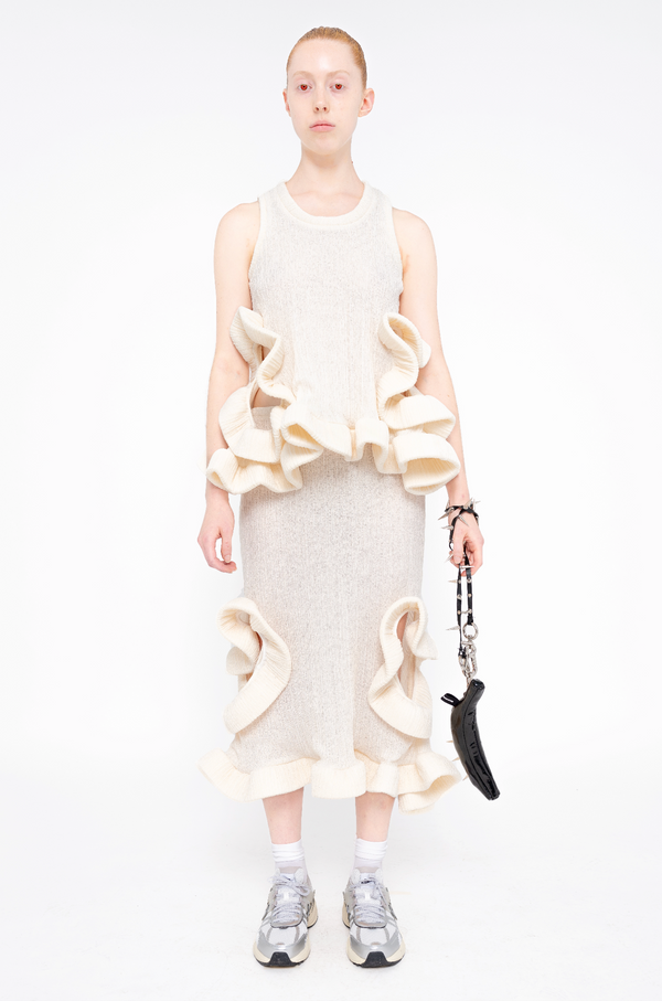 female-wearing-ivory-ruffled-tank-top-and-ivory-ruffled-skirt-with-holes-on-white-background-full-body-front