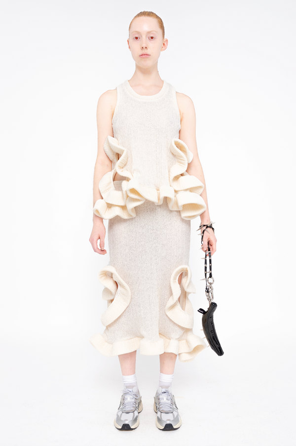 female-wearing-ivory-ruffled-tank-top-and-ivory-ruffled-skirt-with-holes-on-white-background-full-body-front