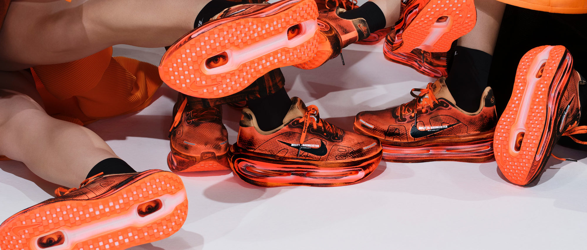 Close-up of orange athletic shoes with a white background