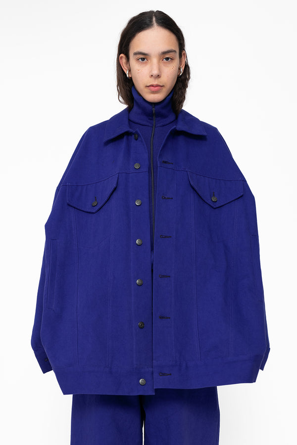 female-wearing-blue-oversized-belted-denim-jacket-with-blue-denim-pants-close-up-torso-front